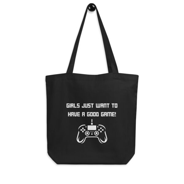 A black tote bag on which is written "girls just want to have a good game!" in white with a white PlayStation controller