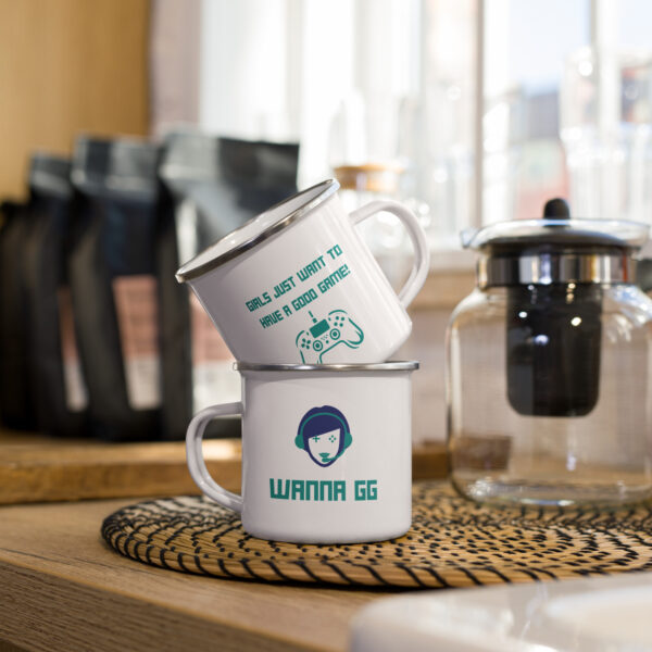 2 cups of the same design, stacked, showing both sides of the cup. First side: "girls just want to have a good game!" in green with a green PlayStation controller underneath Second side: "wanna gg" in green underneath our website logo