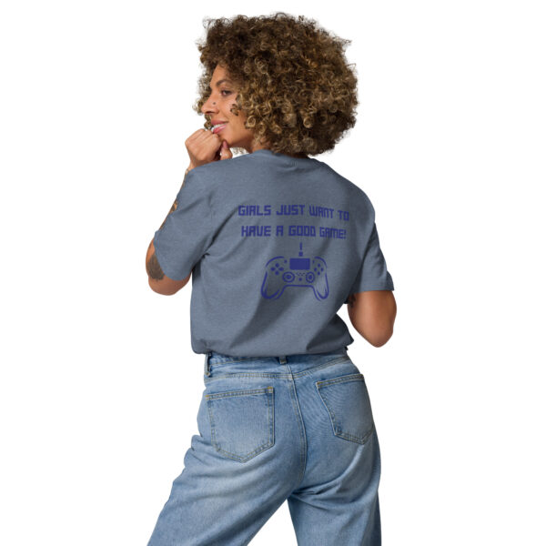 A woman posing from behind wearing a grey tshirt on which is written "girls just want to have a good game!" in blue with a blue PlayStation controller underneath