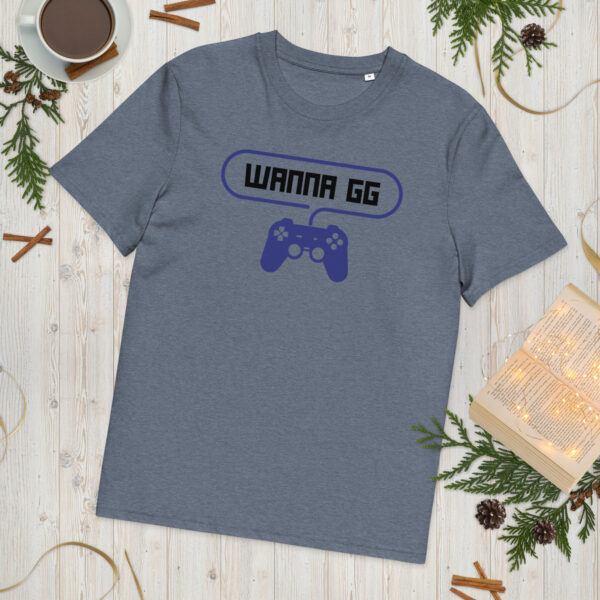 A grey tshirt on which is writting "wanna gg" in black with a blue PlayStation controller