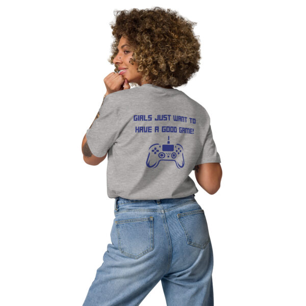 A woman posing from behind wearing a grey tshirt on which is written "girls just want to have a good game!" in blue with a blue PlayStation controller underneath