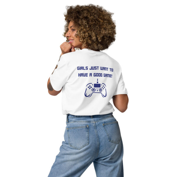 A woman posing from behind wearing a white tshirt on which is written "girls just want to have a good game!" in blue with a blue PlayStation controller underneath