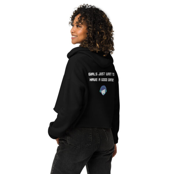 A woman posing from behind wearing a black sweatshirt on which is written "girls just want to have a good game!" in white with our website logo