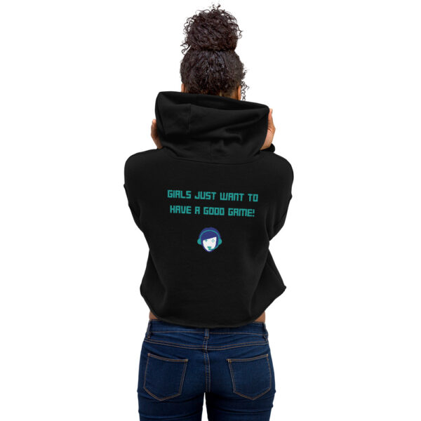 A woman posing from behind wearing a black sweatshirt on which is written "girls just want to have a good game!" in green with our website logo