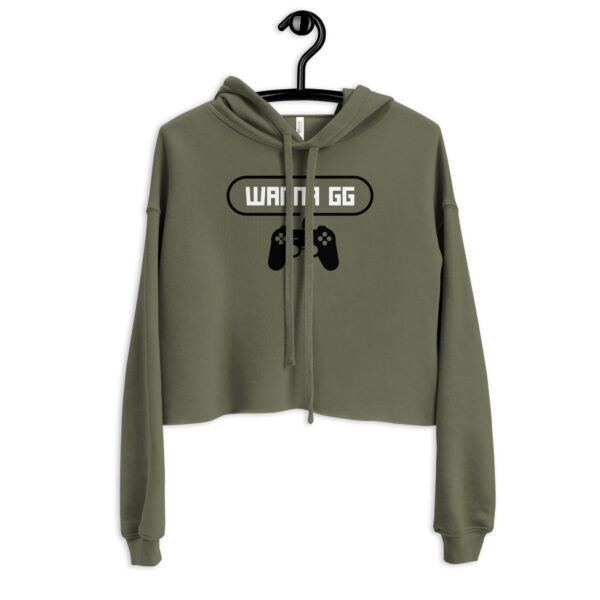 A khaki-coloured sweatshirt on which is writting "wanna gg" in white with a black PlayStation controller underneath