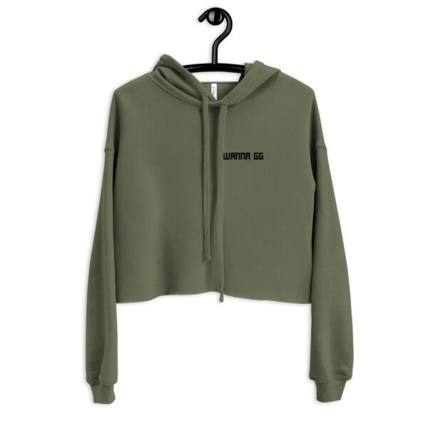 A khaki-coloured sweatshirt on which is writting "wanna gg" in black on the side