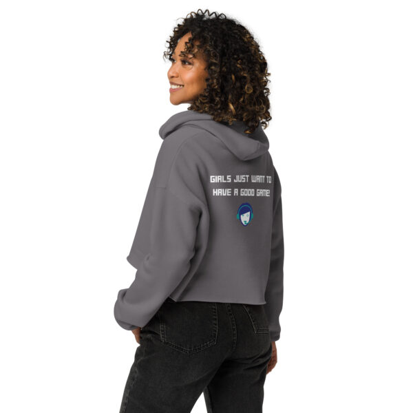 A woman posing from behind wearing a grey sweatshirt on which is written "girls just want to have a good game!" in white with our website logo